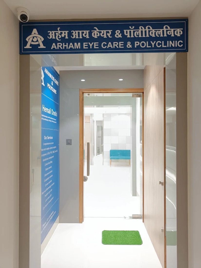 Entrance of Arham Eye Care & Polyclinic with the blue bilingual signboard (Hindi and English) above the doorway, Pant Nagar, Ghatkopar East, Mumbai